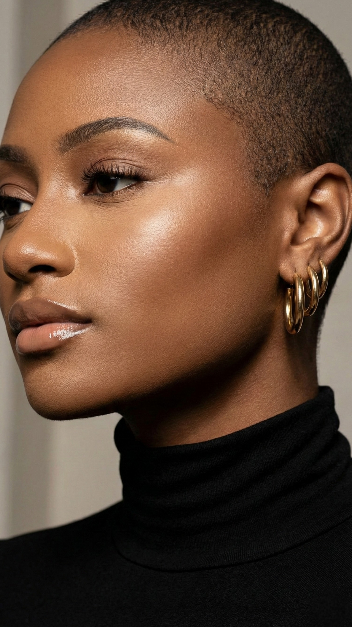 Classic hoop & textured earring set — pair of minimalist hoops and a textured statement hoop on a jewelry card with a soft cloth.
