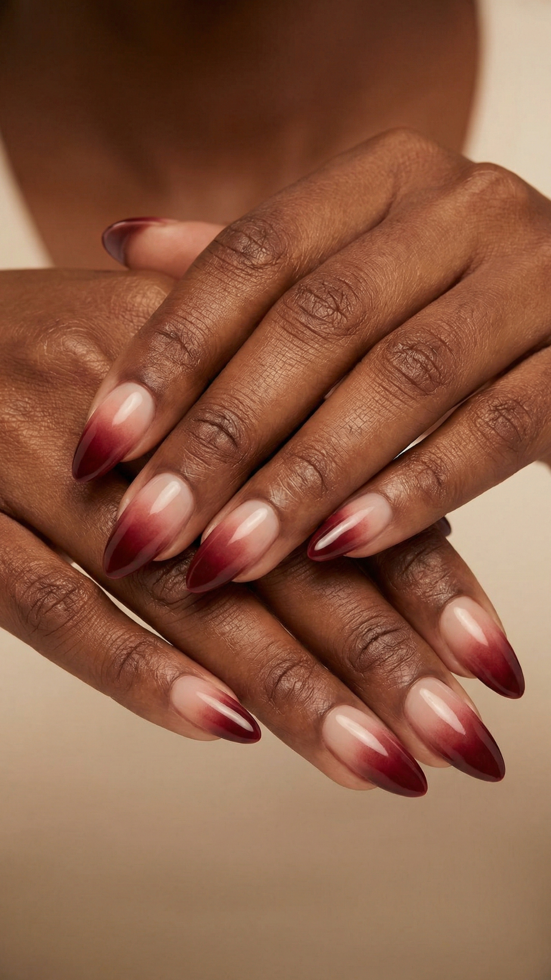 Mulled Wine Ombré Tips — “Almond nails with sheer nude base and gradient wine-colored tips blending softly downward, glossy finish.”
