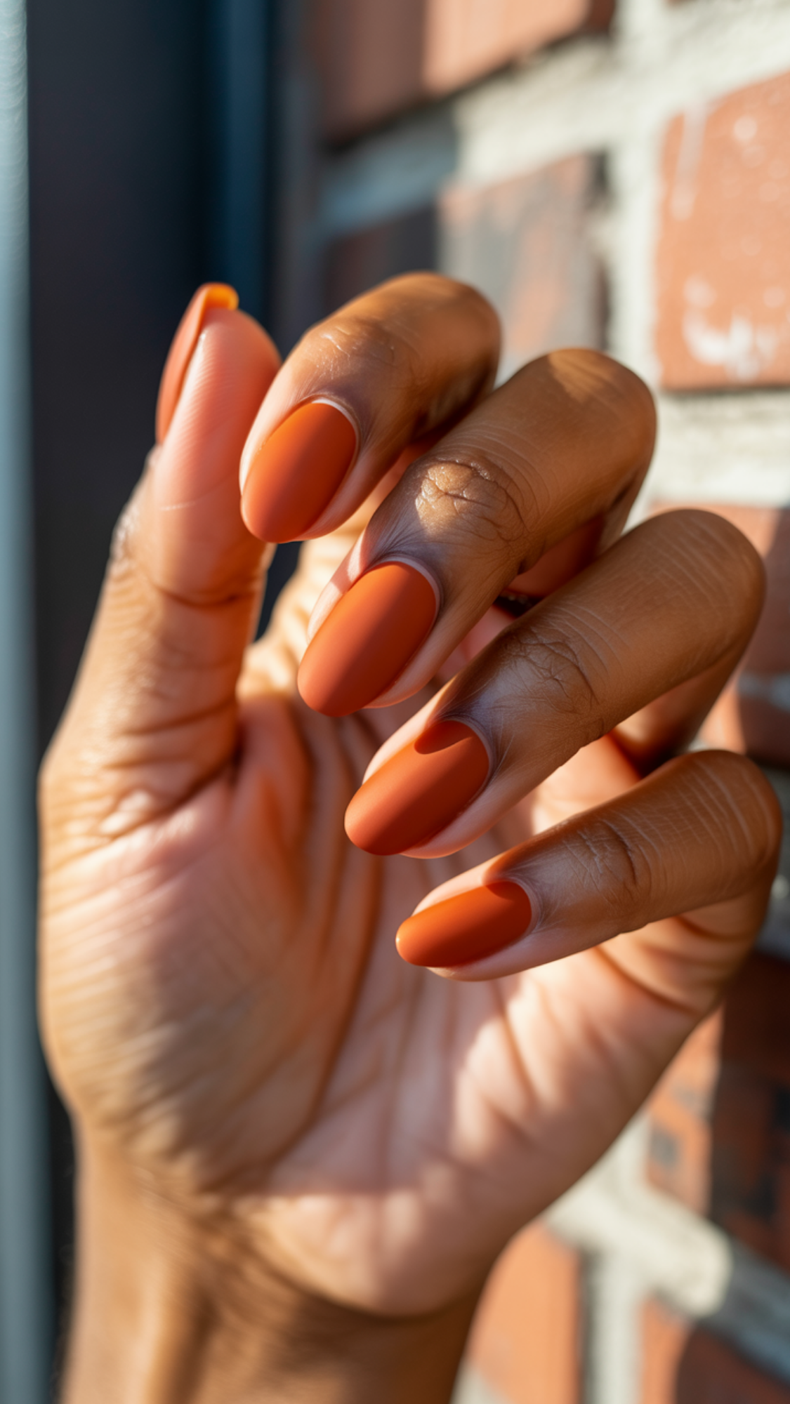Burnt Orange Matte — “Squoval or almond nails painted in a rich terracotta matte crème finish.”
