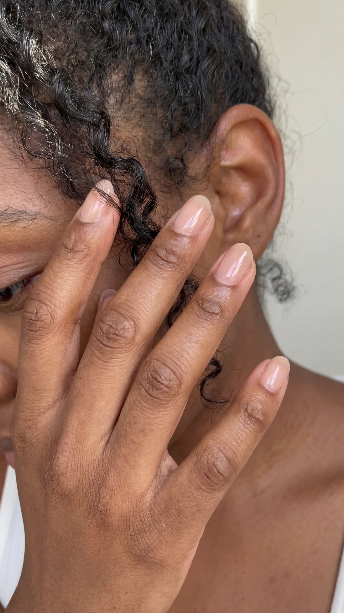 Cashmere Nude (Barely-There) — “Short oval nails in a sheer cashmere-nude jelly, glossy finish, minimal and natural.”
