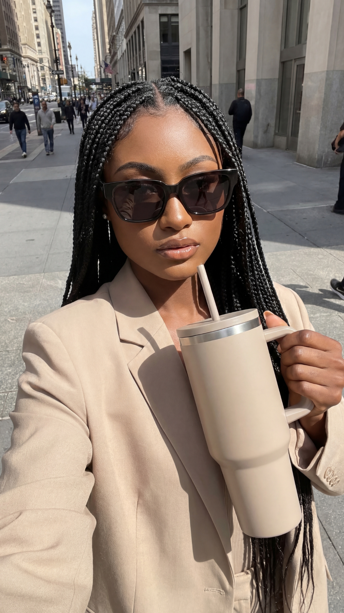 Stylish reusable coffee cup or travel tumbler in a neutral modern design, shown on a table with a latte—eco-friendly, temperature-keeping cup for daily coffee runs.