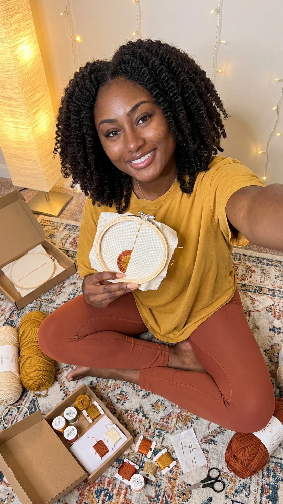 DIY craft kit / rainy day creative kit — boxed craft kit (yarn, paints, or DIY materials) arranged with a mug and project instructions.
