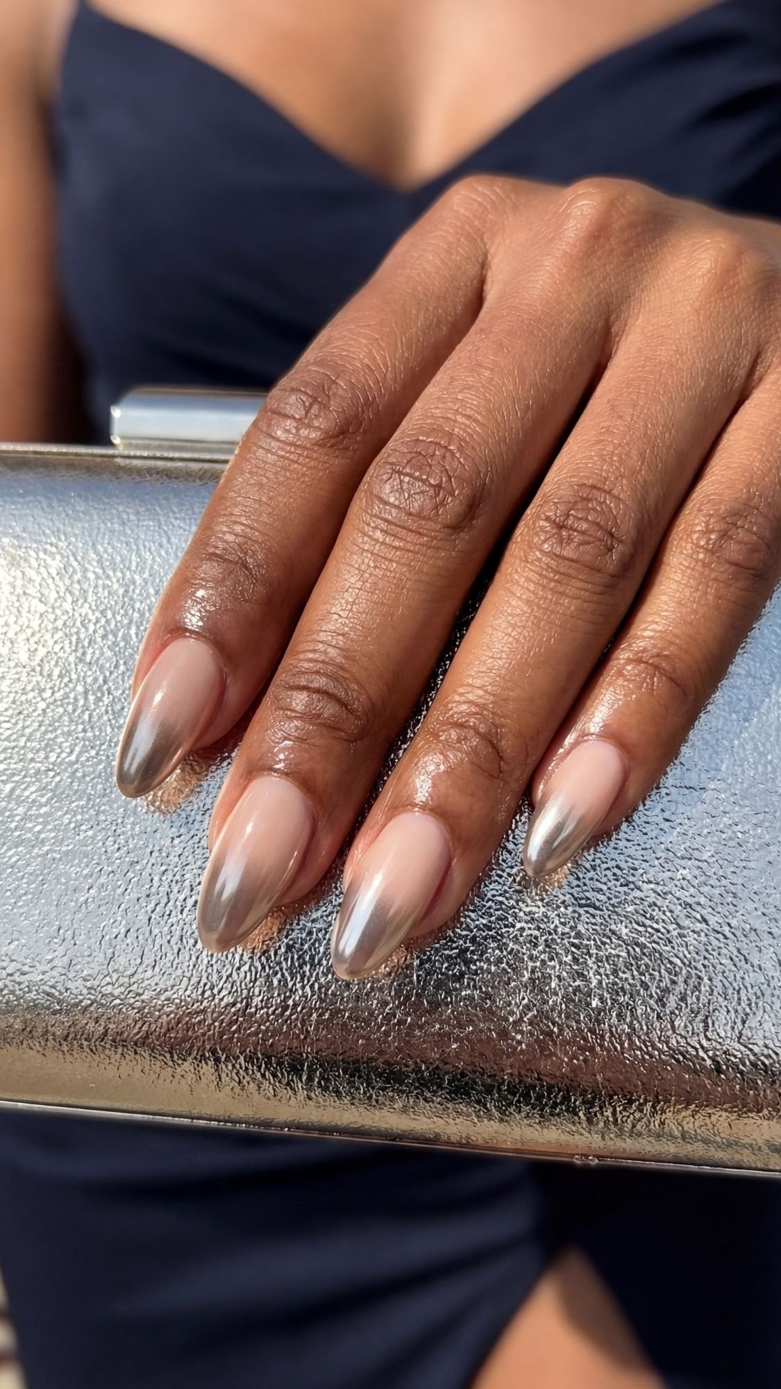 Chrome Ombre Almond Tips — Almond nails showing a gradual chrome fade concentrated at the tapered tips.