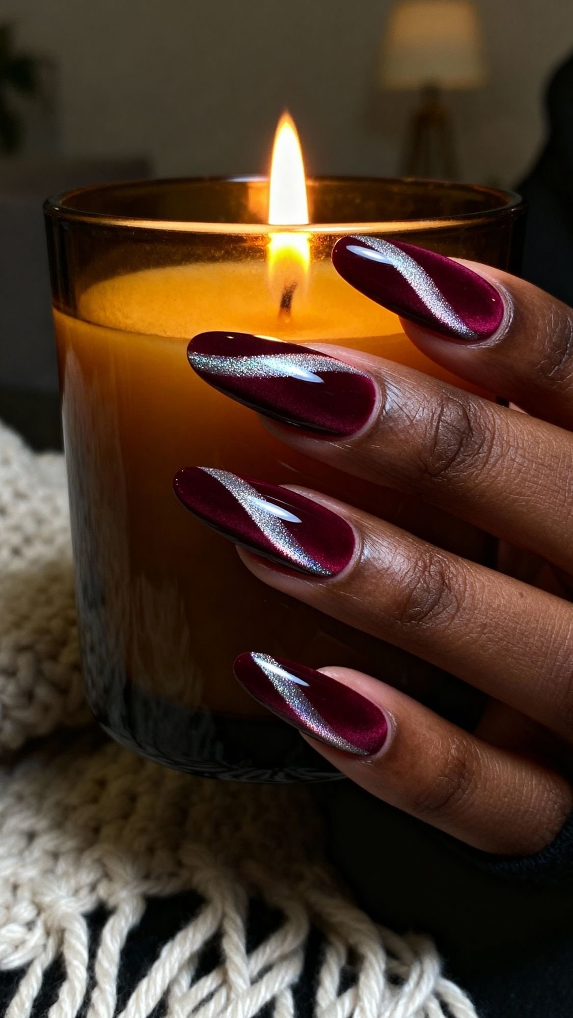 Velvet Cat-Eye Almond Nails — Dark almond nails featuring a diagonal cat-eye shimmer line from a magnet.