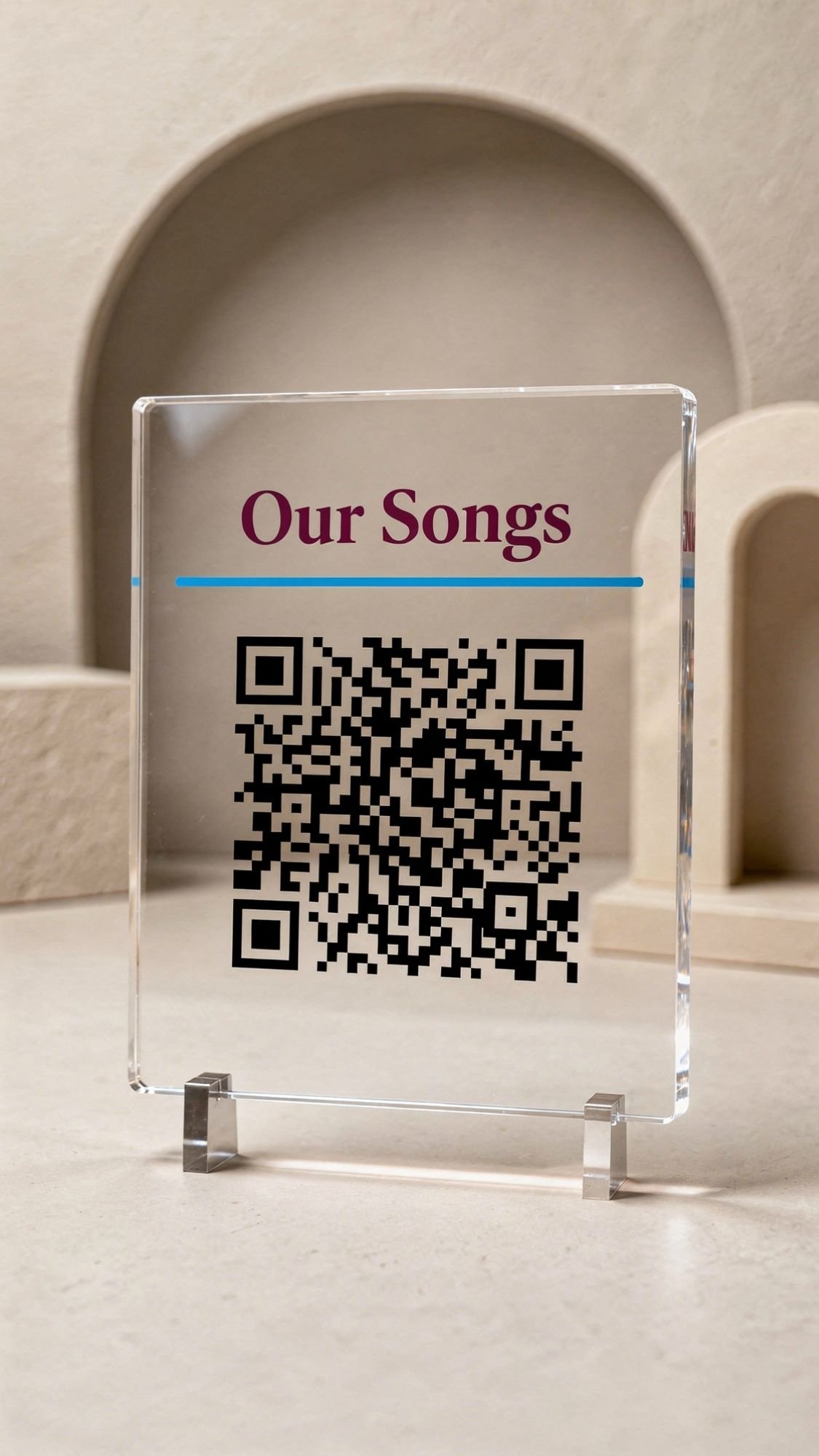 A clear acrylic sign with the words Our Songs above a black QR code, displayed on a light beige surface with a minimalist, arched background—perfect for easy handmade gifts or thoughtful birthday gifts for best friend.