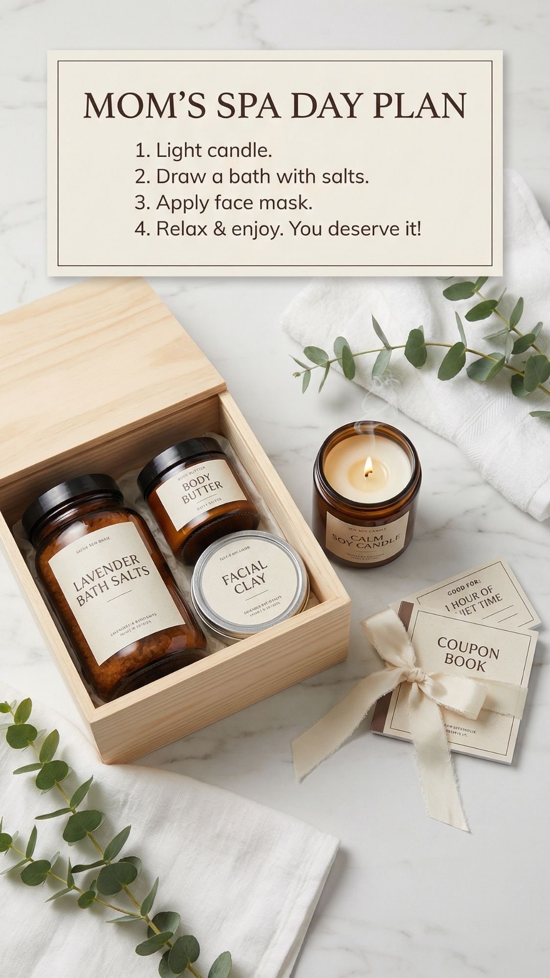 A flat lay of an at-home spa gift set with bath salts, body butter, facial clay, a lit candle, a coupon book tied with a ribbon, and eucalyptus sprigs. A sign lists steps for a mom spa day: light candle, bath, face mask, relax.