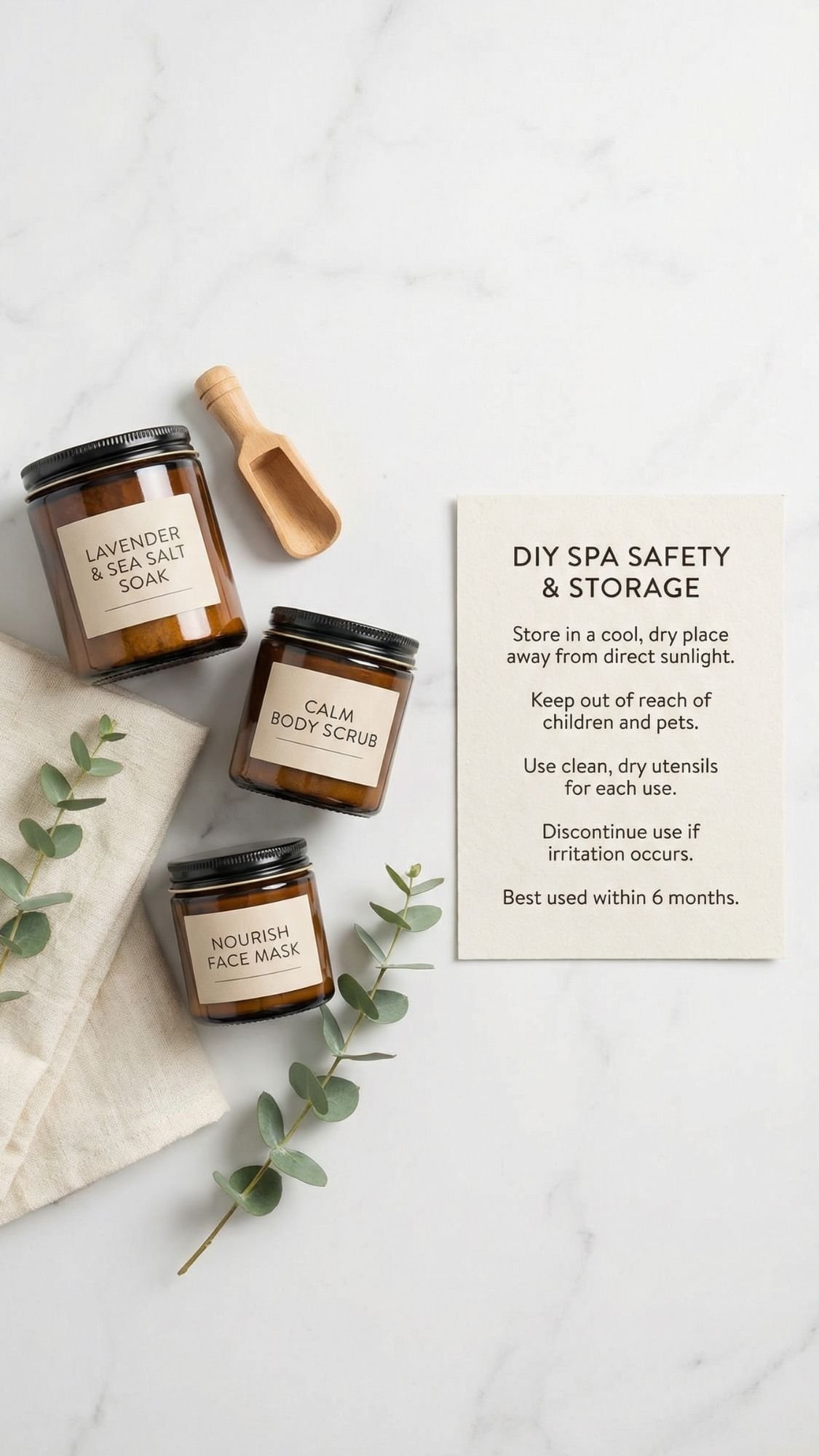 Three brown glass jars labeled Lavender Epsom Salt Soak, Calm Body Scrub, and Nourish Face Mask are arranged on a white surface with a wooden scoop, eucalyptus sprig, and a card listing DIY spa gifts safety and storage tips.