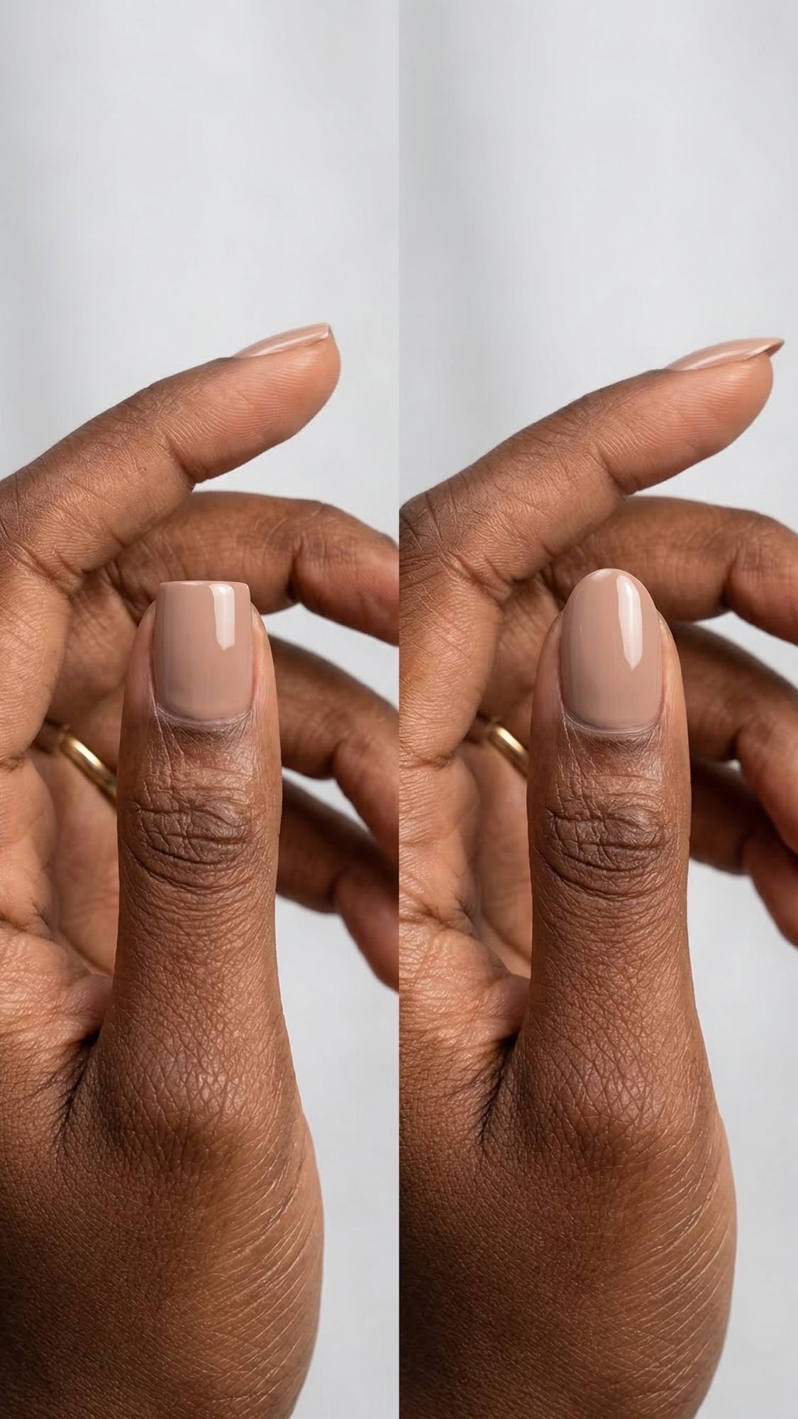 A close-up of a hand with elegant nails, showing two thumbs with neatly manicured short nails painted in a glossy nude beige color, against a soft gray background. The person is wearing a simple gold ring.